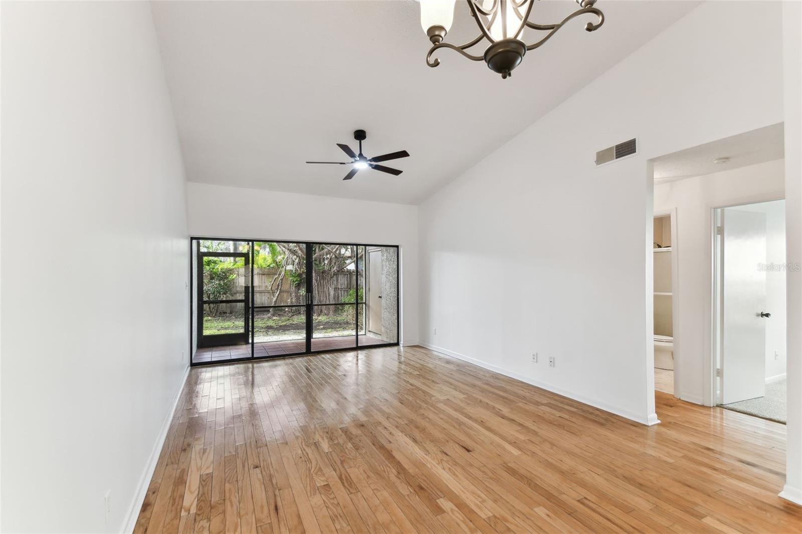 Open living & dining area with hardwood floors