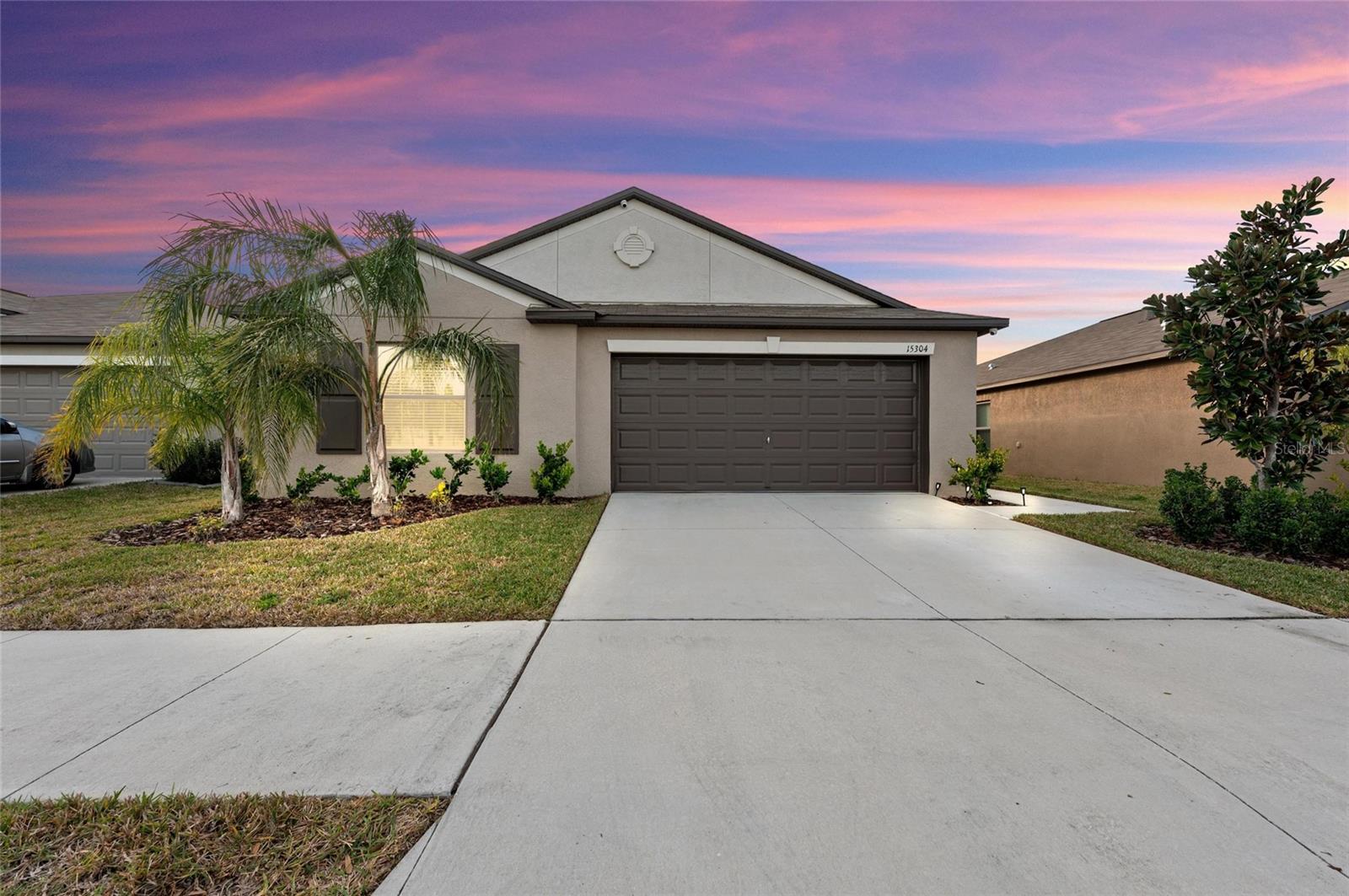 Front exterior of home with 2 car garage.