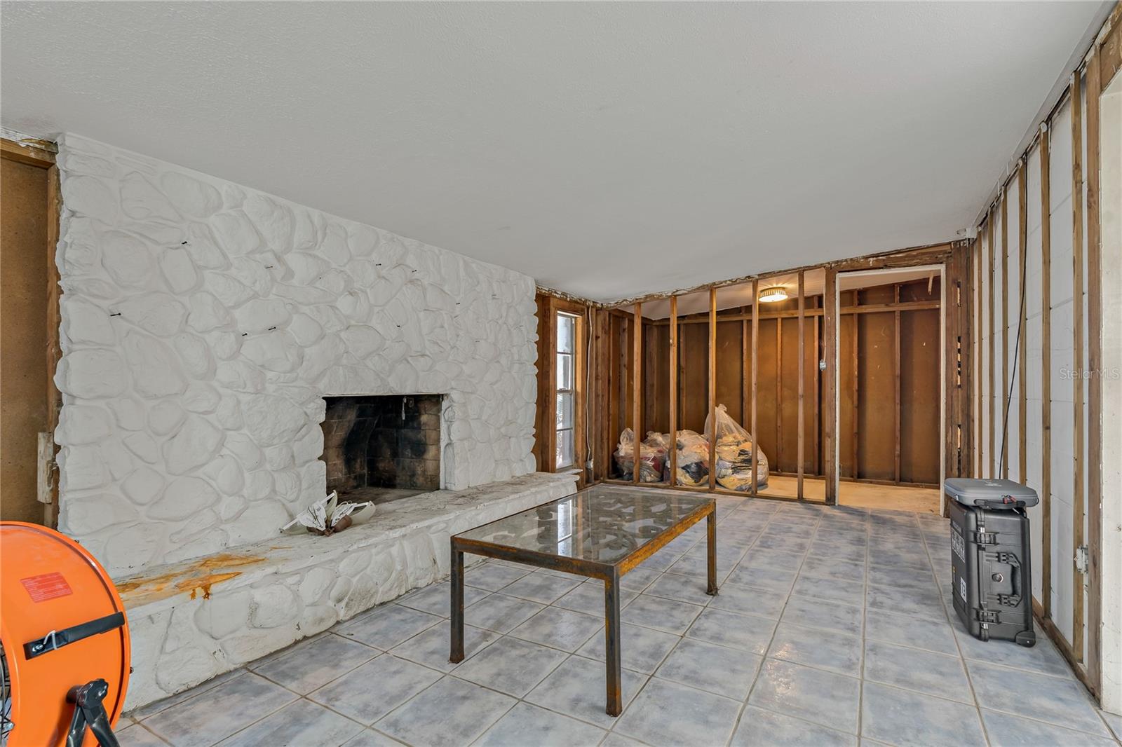 LIVING ROOM WITH WOOD BURNING FIREPLACE