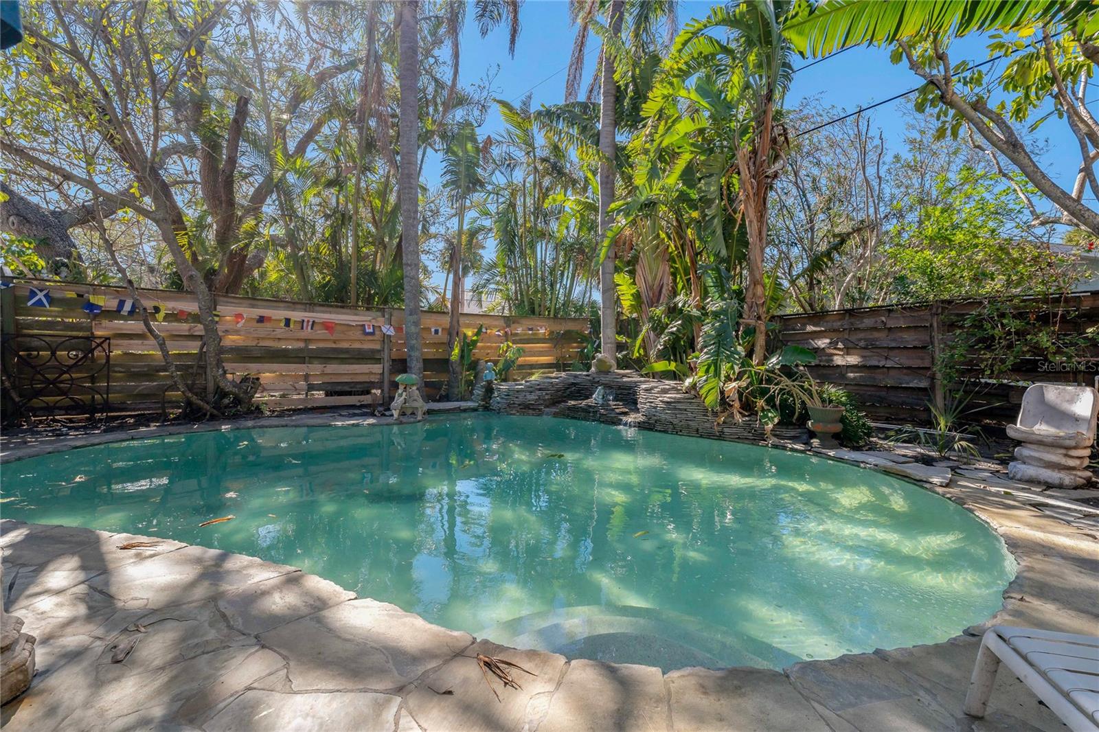 STUNNING POOL AREA WITH SOOTHING WATERFALL