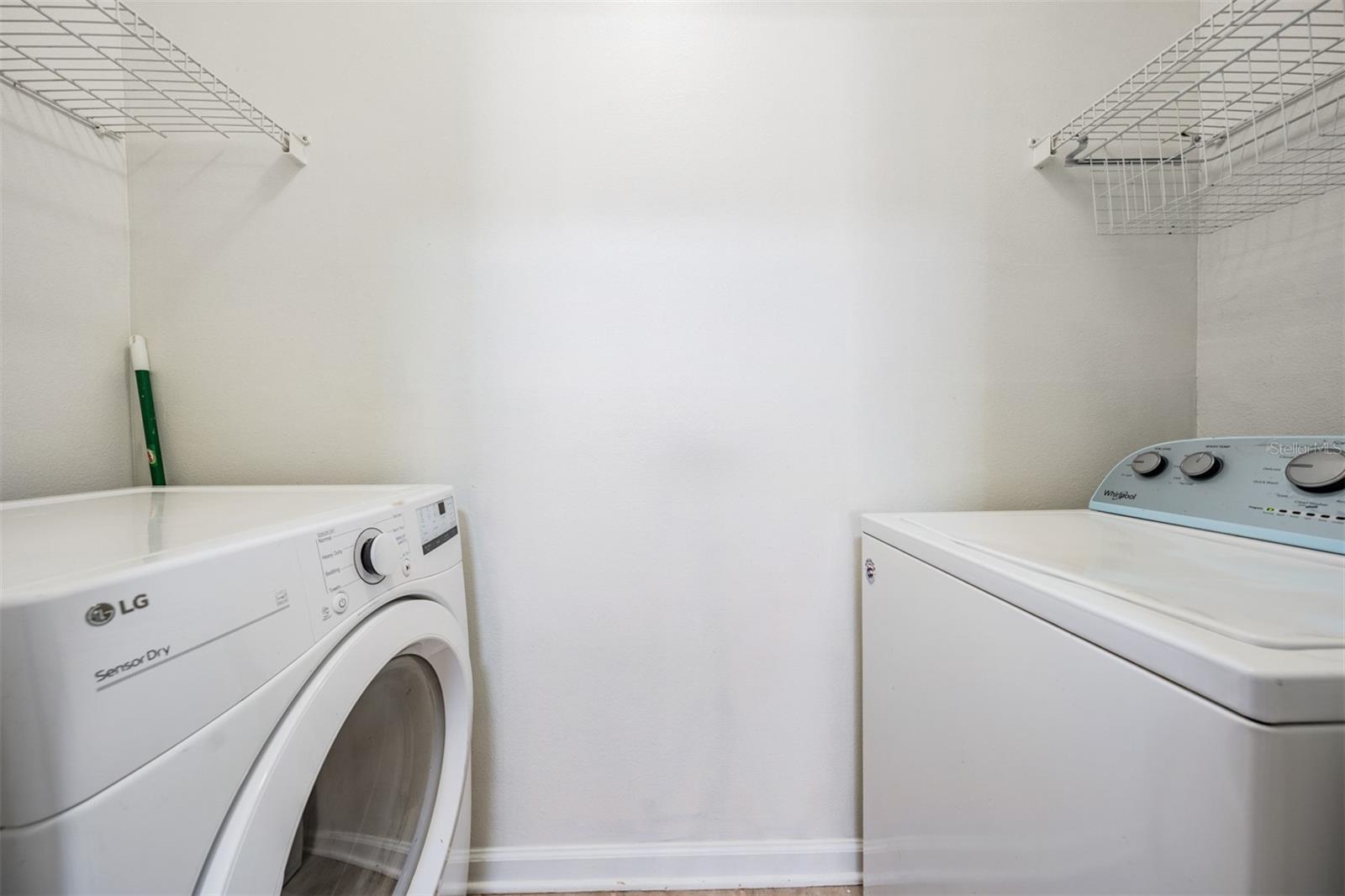 laundry closet with washer & dryer included