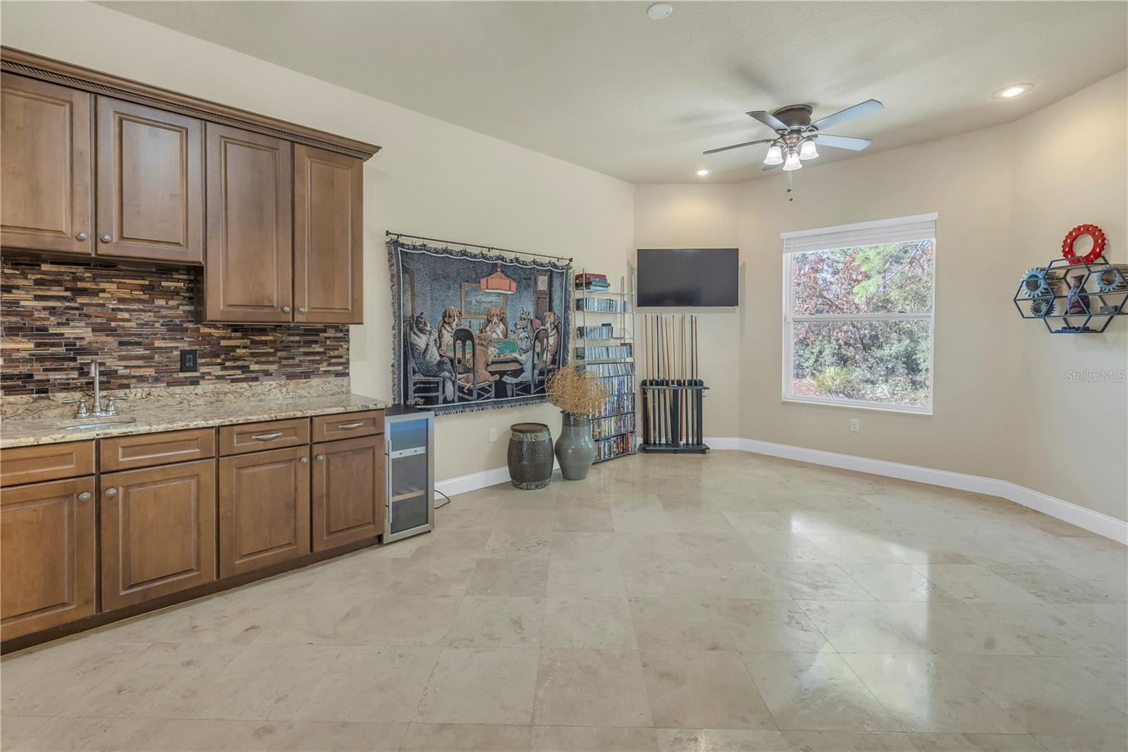 Billiard room off the family room with custom bar area