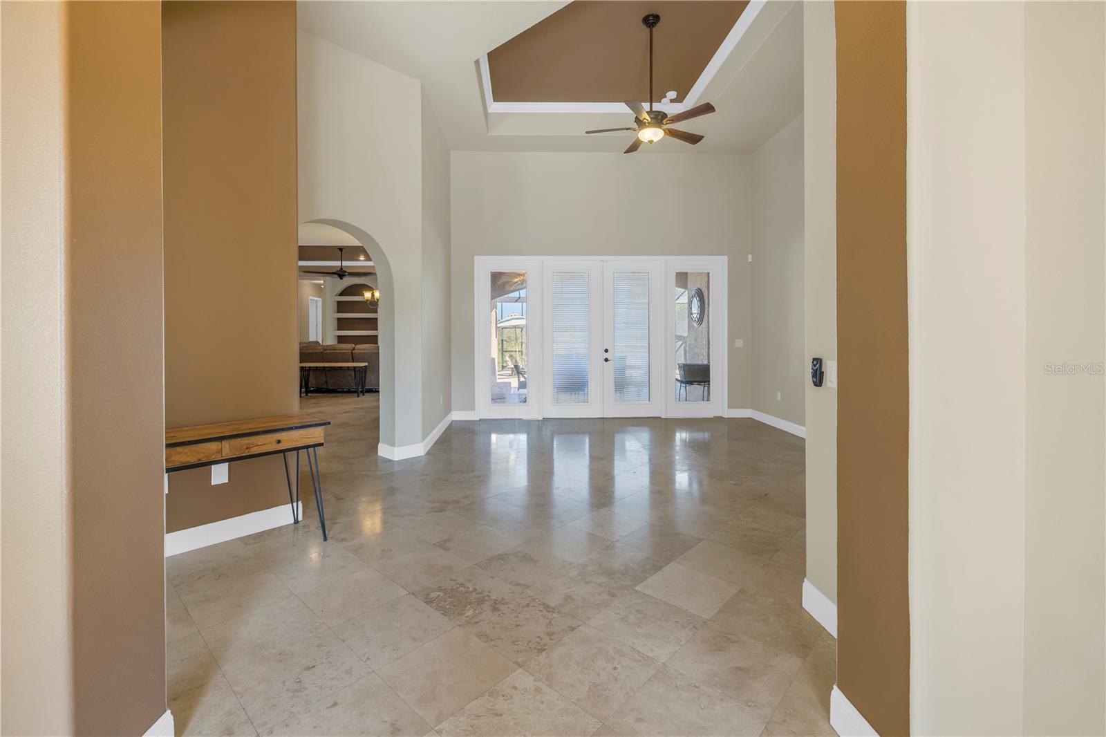 Travertine floors, tray ceilings and moldings