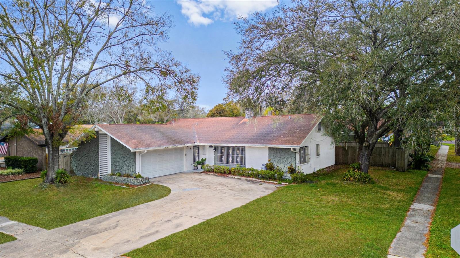 Classic ranch-style design with a spacious two-car garage and an extended driveway