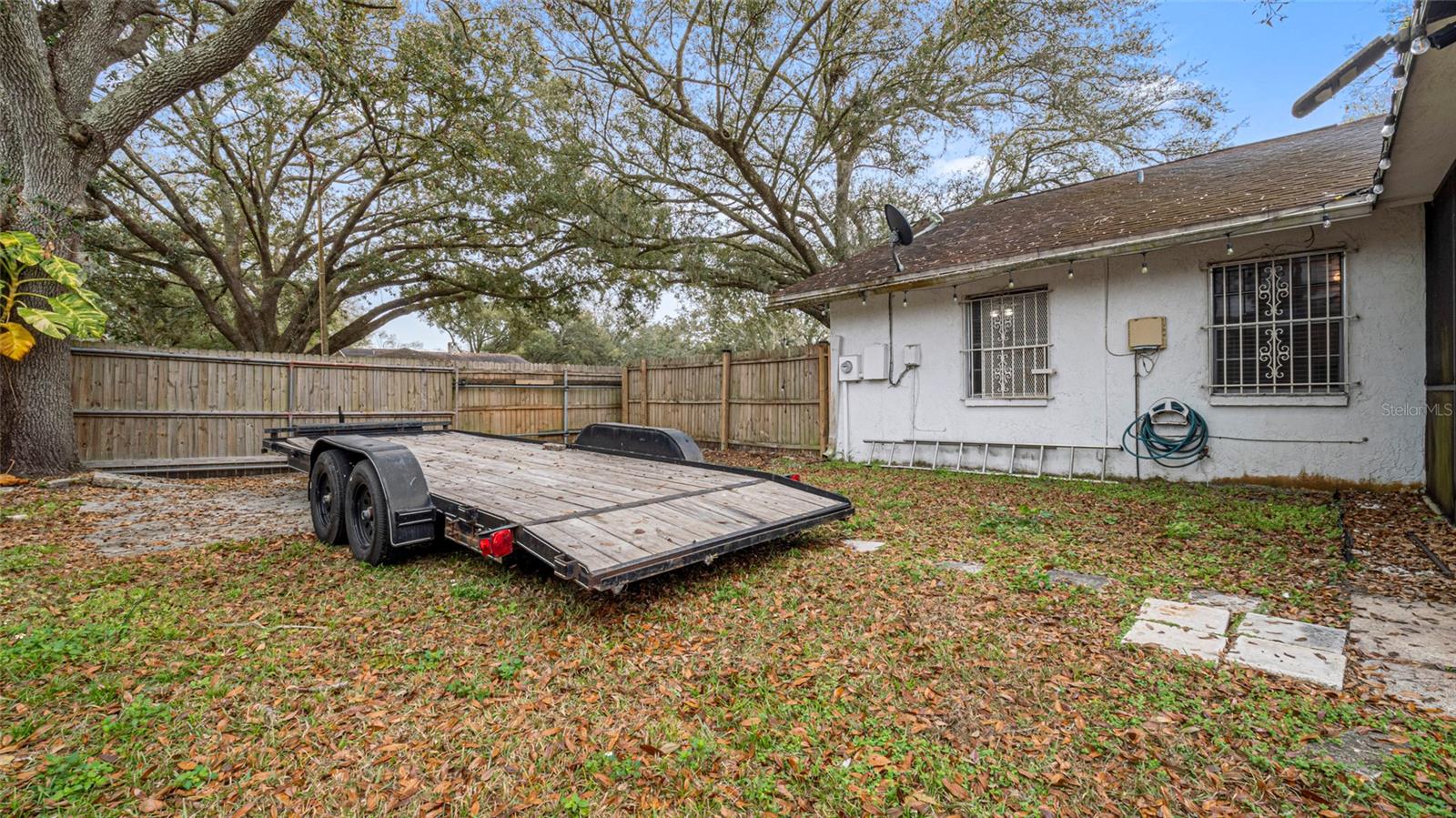 A side gate provides easy access for parking a car, RV, boat, or any other recreational vehicle.