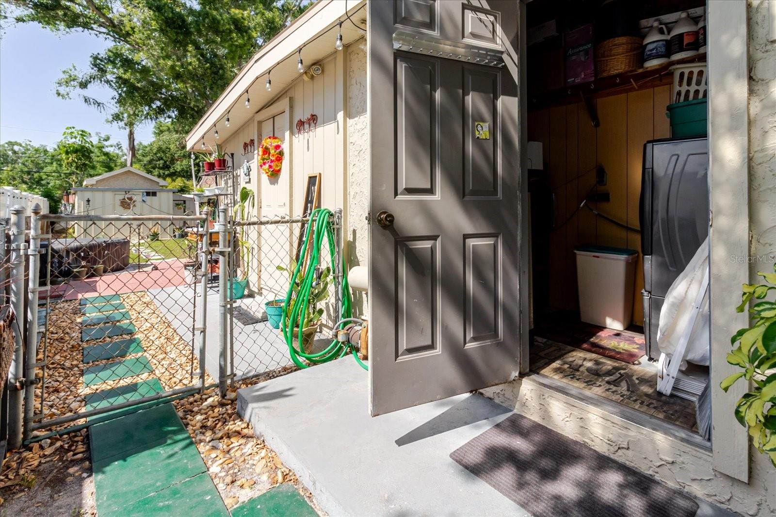 West Side of The House With Door To Laundry