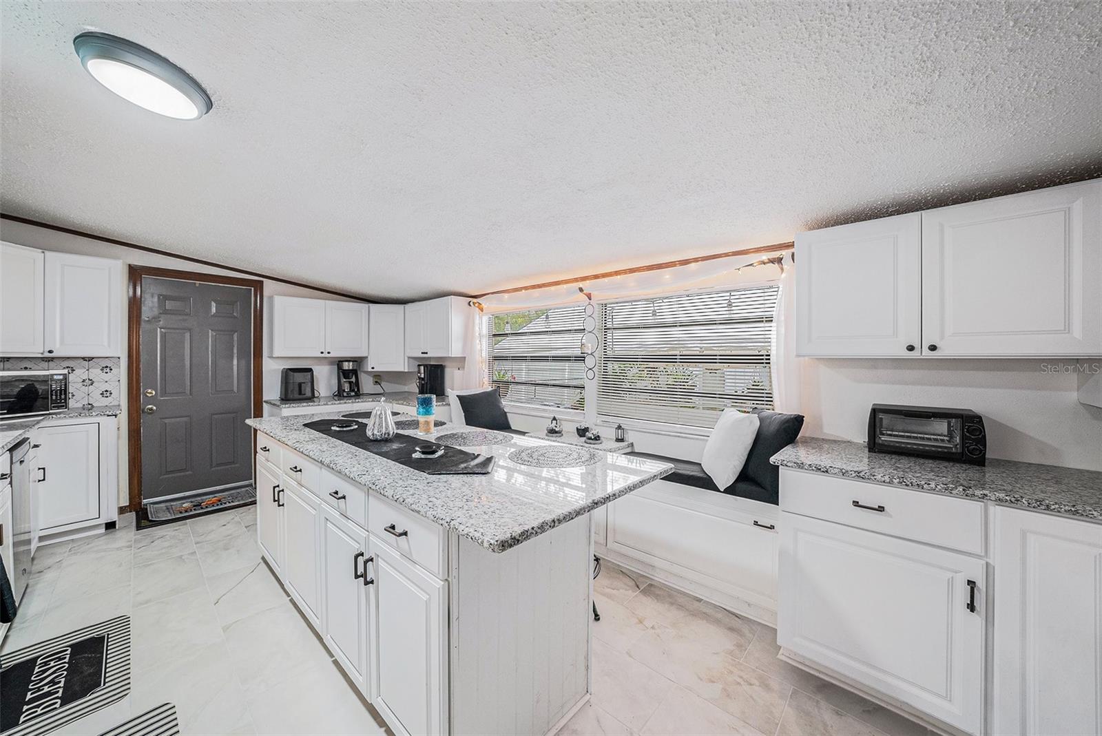 Huge, Gorgeous  Kitchen with Granite Counters, Breakfast Bar, and Stainless Steel Appliances 3