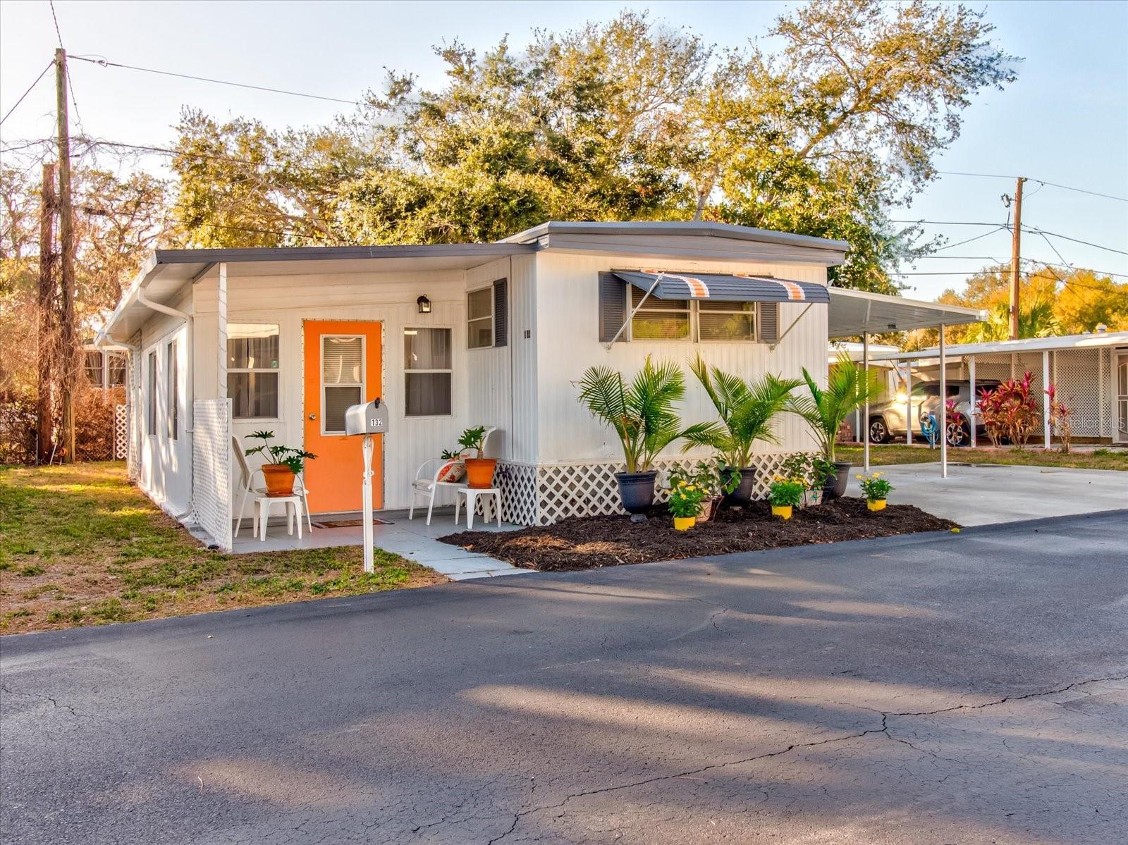 Front of Home With Florida Lanscaping and Parking for Three Vehicles 1