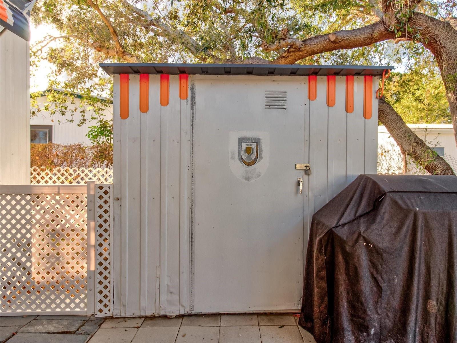 Two Car Carport With Patio Seating,  Laundry Shed and Extra Parking Pad For Third Vehicle