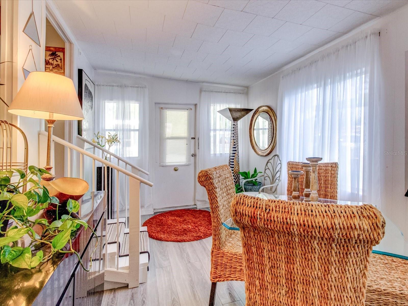 Dining Room With Doorway to Second Bedroom With Barn Door