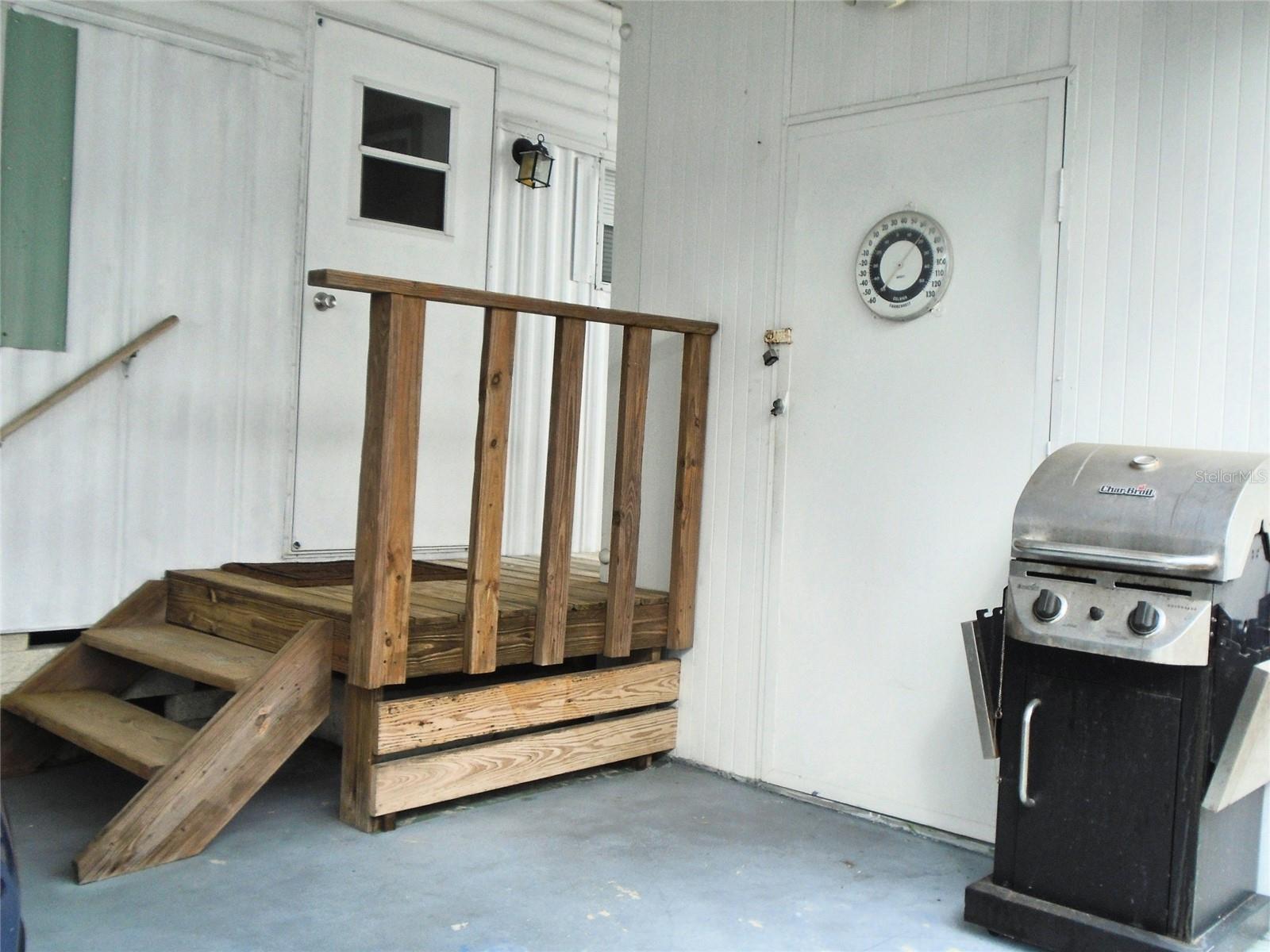 Covered Carport Side Door Entry / Shed with Washer & Dryer Hook-up