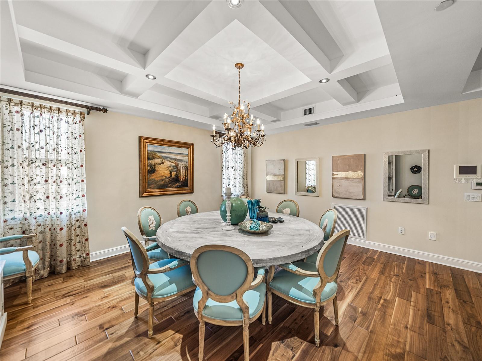 Coffered ceilings add style and natural light from the two windows make the room bright and cheerful!