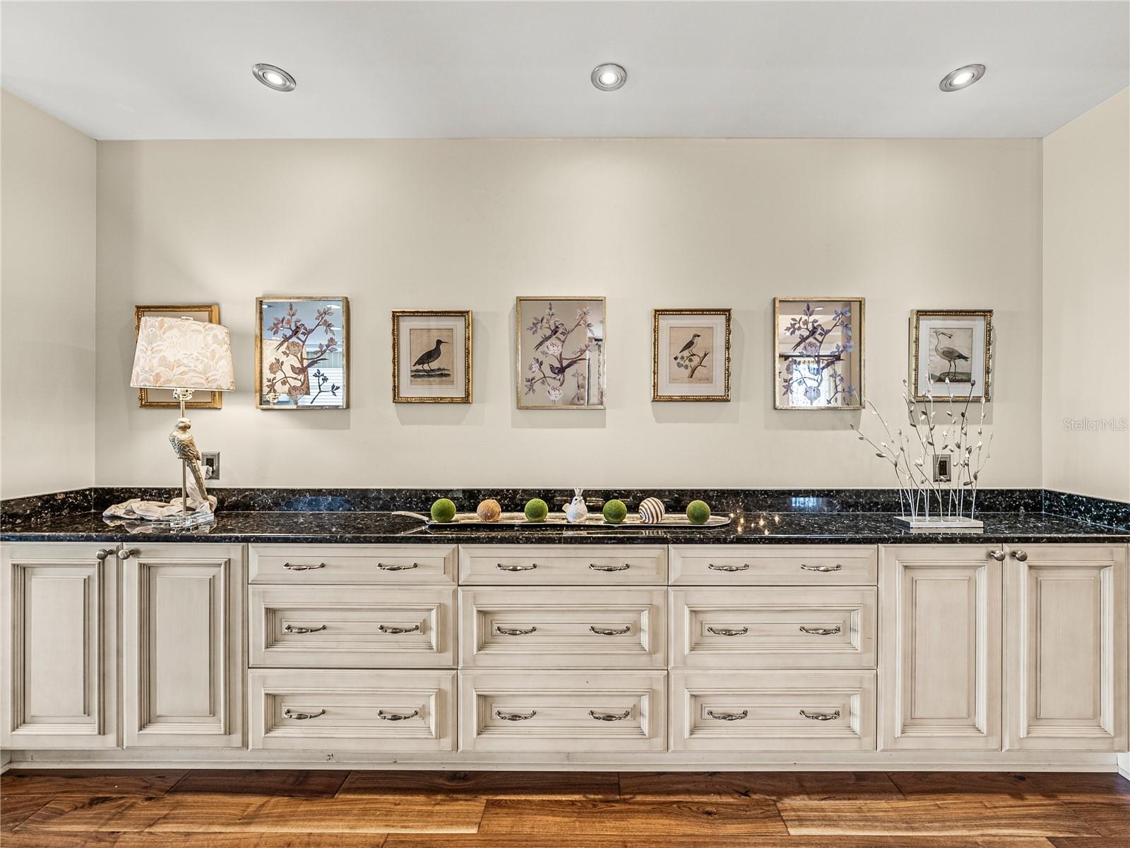 This bank of cabinets with granite countertop in the hallway, adjacent to the kitchen & dining room, is a perfect place for all of your china, specialty platters,etc. It is also perfect for buffet placement!