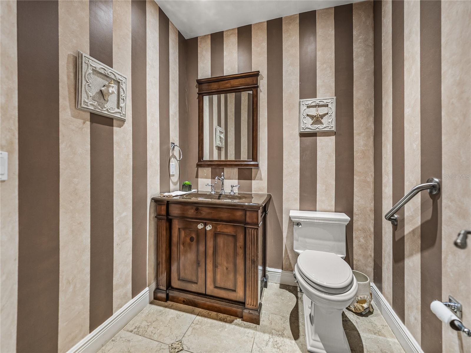 The half-bath, located off of the hallway, is convenient to the main living area