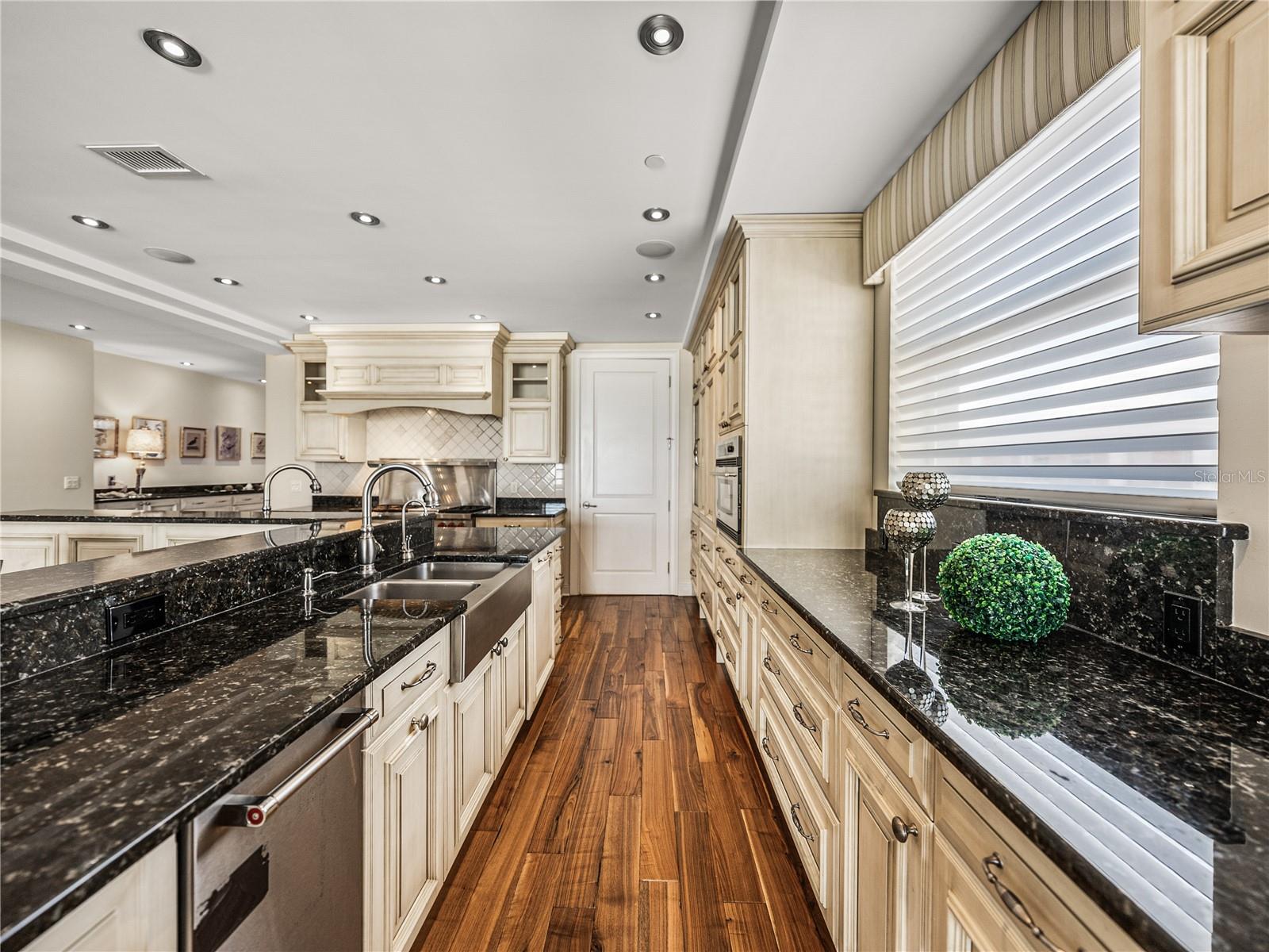 This is the clean side, with a deep farm house sink,dishwasher, ice maker and a large window inviting in the sunlight.