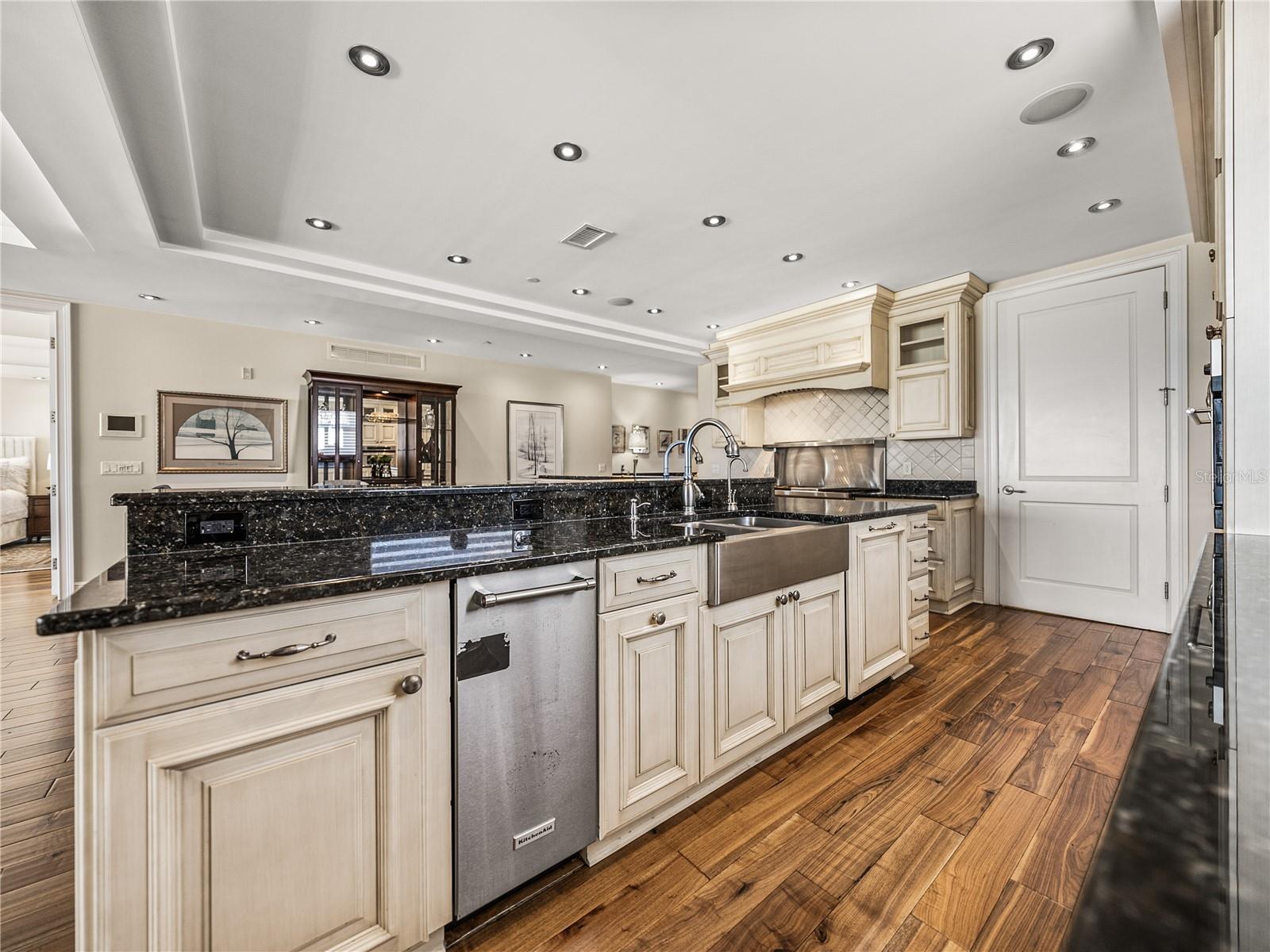 The dishwasher with integrated door is to the right of the sink.