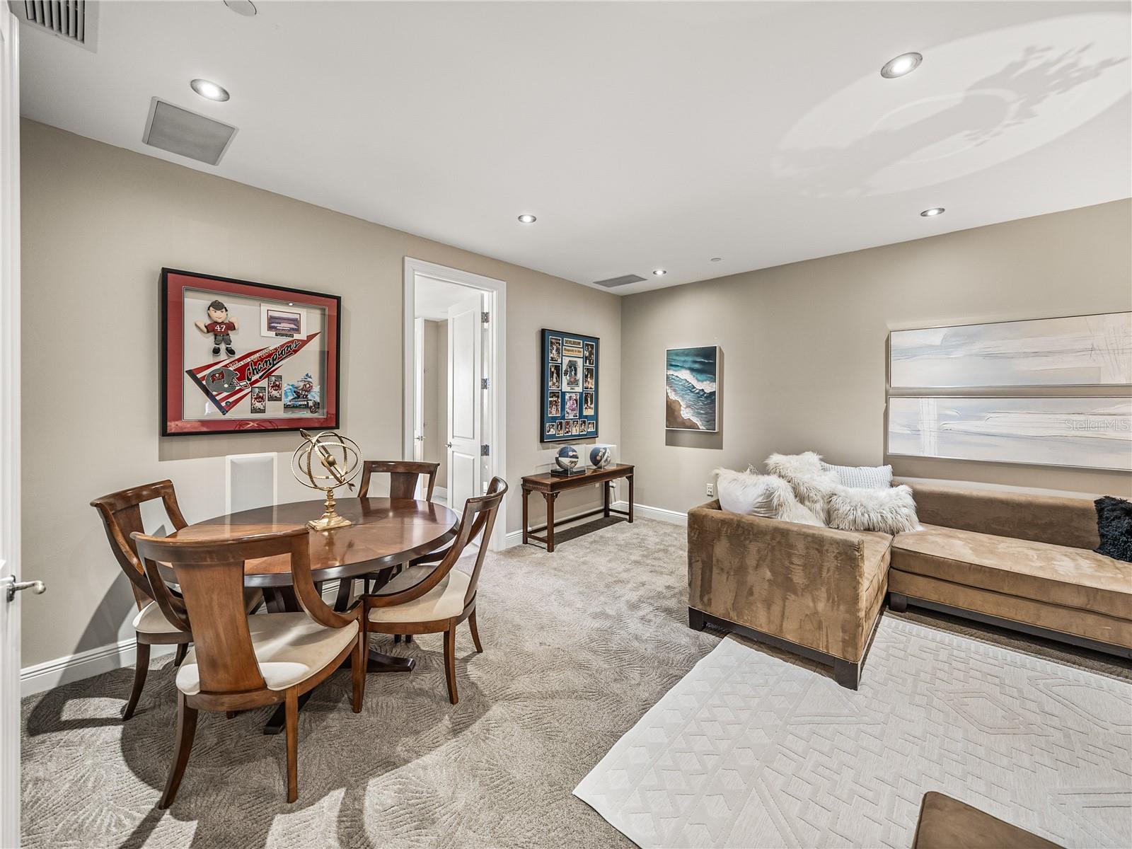 All media rooms must have carpet with a thick insulating pad for absorbing sound. The door to the left leads to a full bathroom, which also services that bedroom. This is another unique feature for Unit 400.