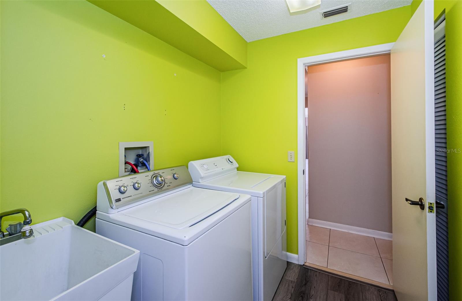 Inside Full Laundry Room w/ Utility Sink