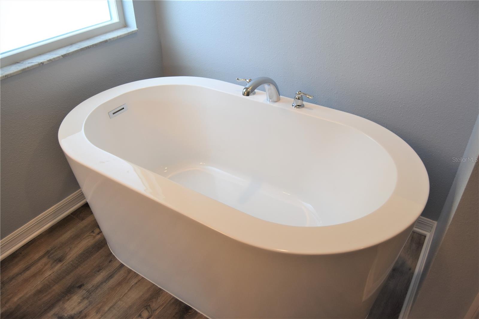 Stand alone soaking tub.