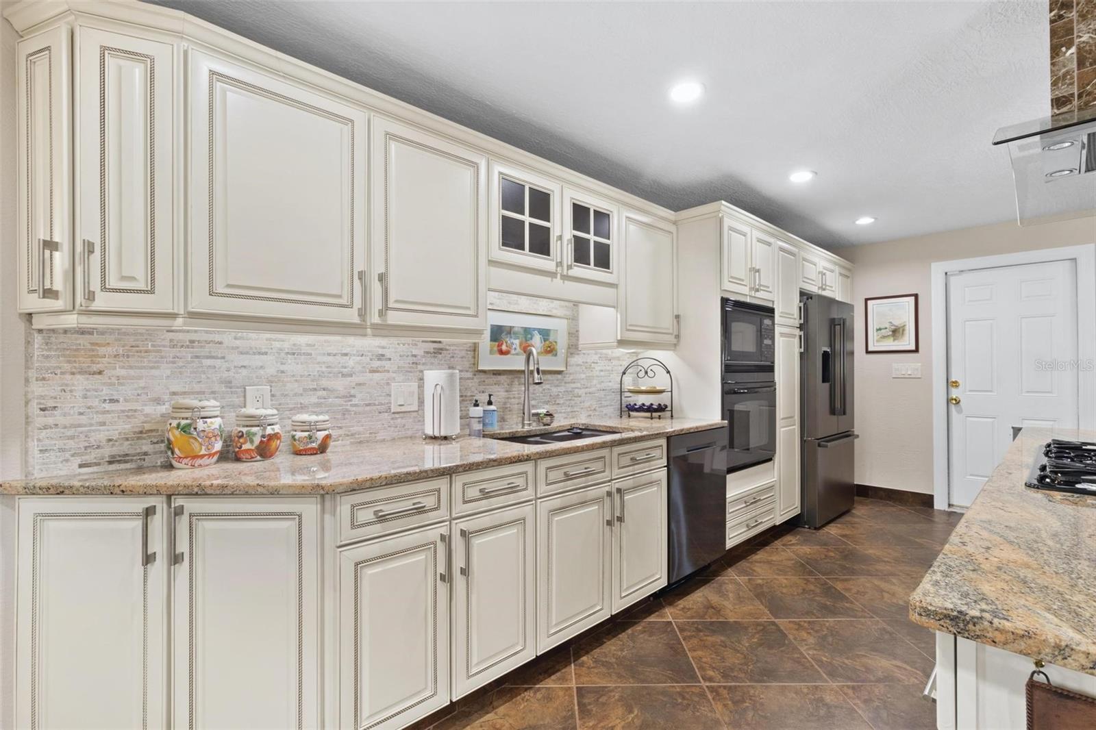 The custom stone backsplash adds to the appeal.