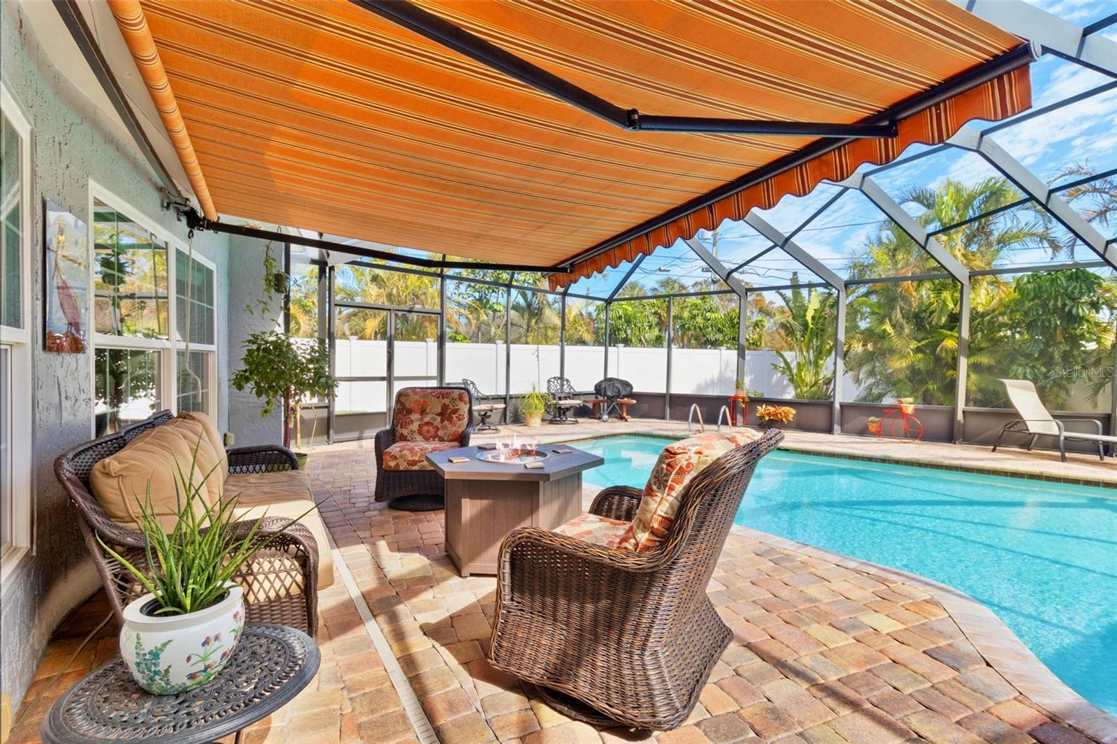 Poolside, there's a retractable awning for covered lounging.