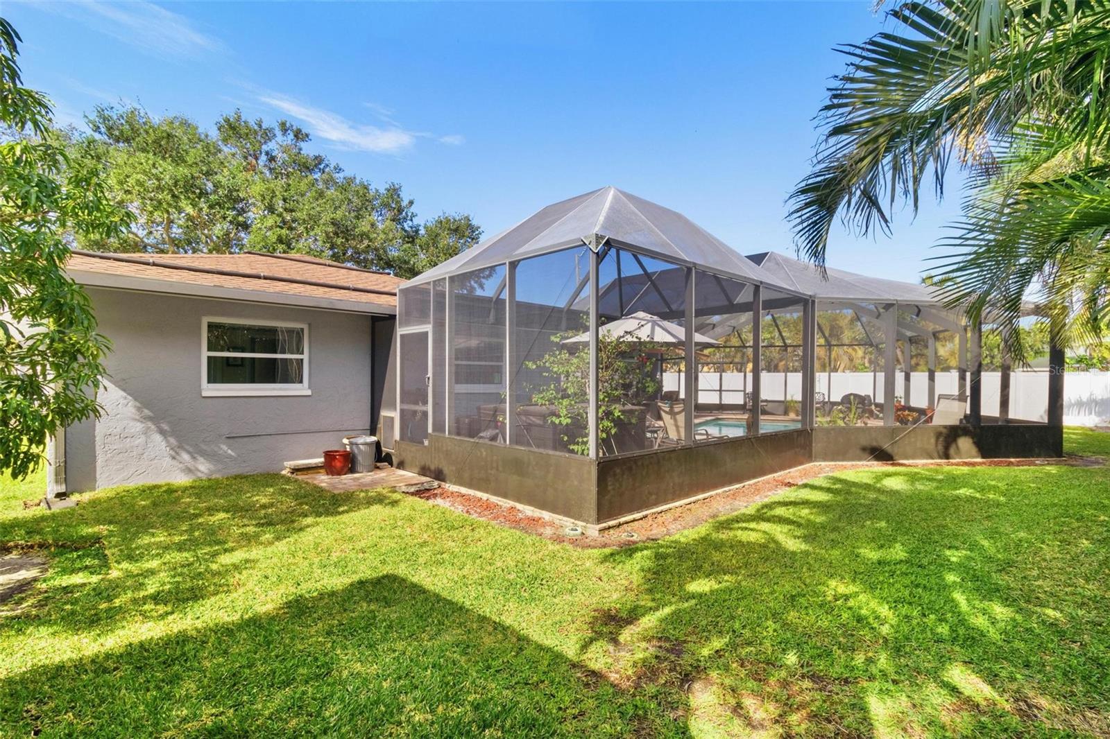 There's plenty of yard space outside the screen enclosure.