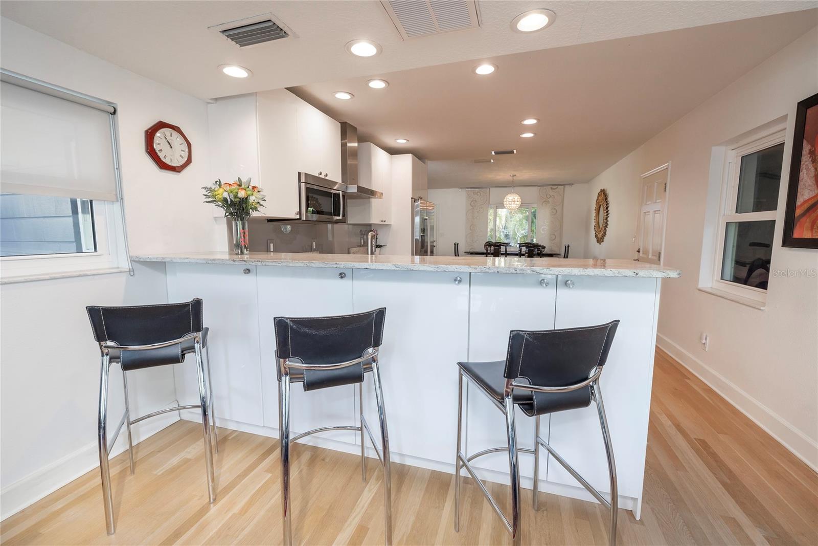 Extra seating and cabinets at the breakfast bar