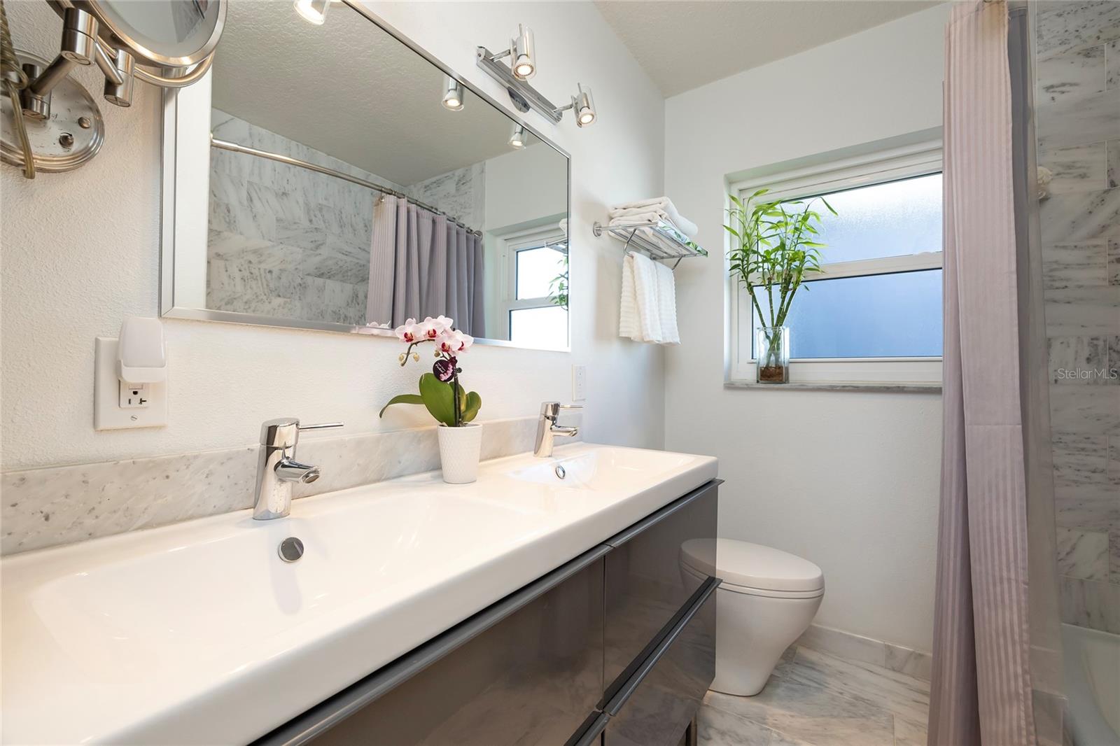 Primary bath with double sinks and walk in shower