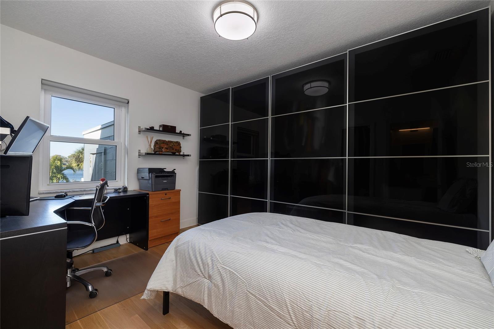 Bedroom 2 has water view and row of removable closets