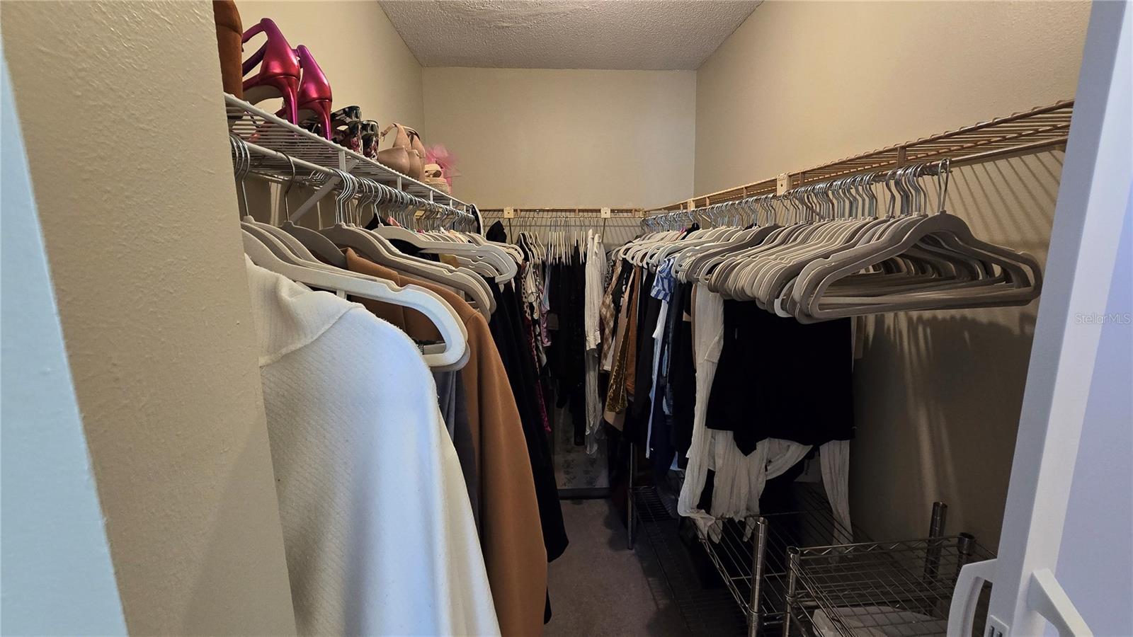 Huge walk in closet located in the Primary bedroom