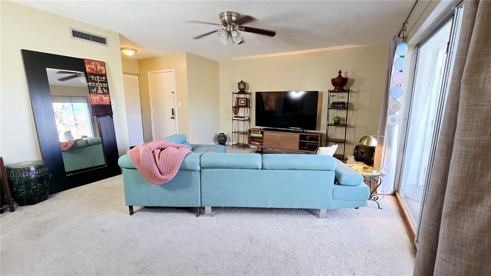 Living room and front door to the left