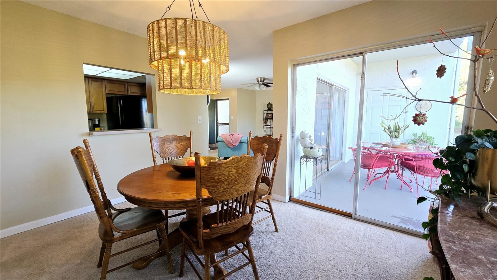 Dining Room and a view of the kitchen with a convenient pass through