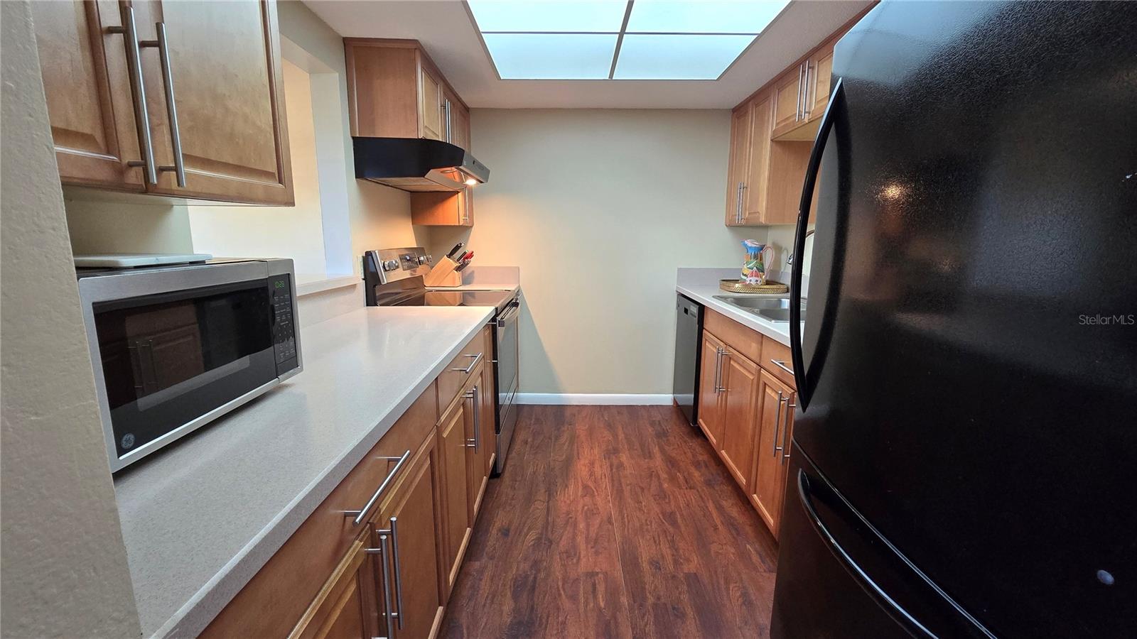 Well maintained kitchen with plenty of cabinets and beautiful Corian countertops.  All appliances stay!