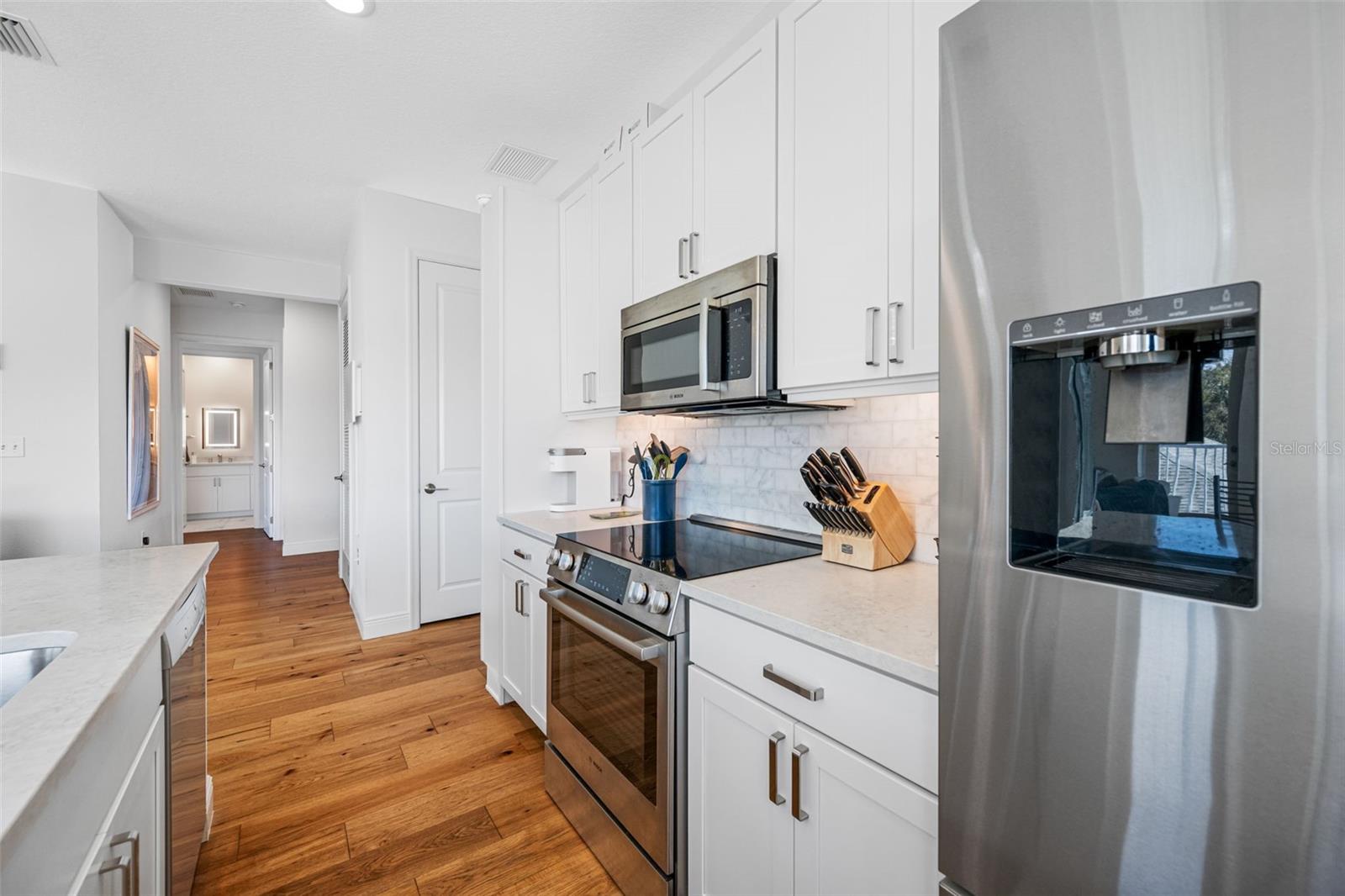 A pantry closet adds to the abundance of kitchen storage