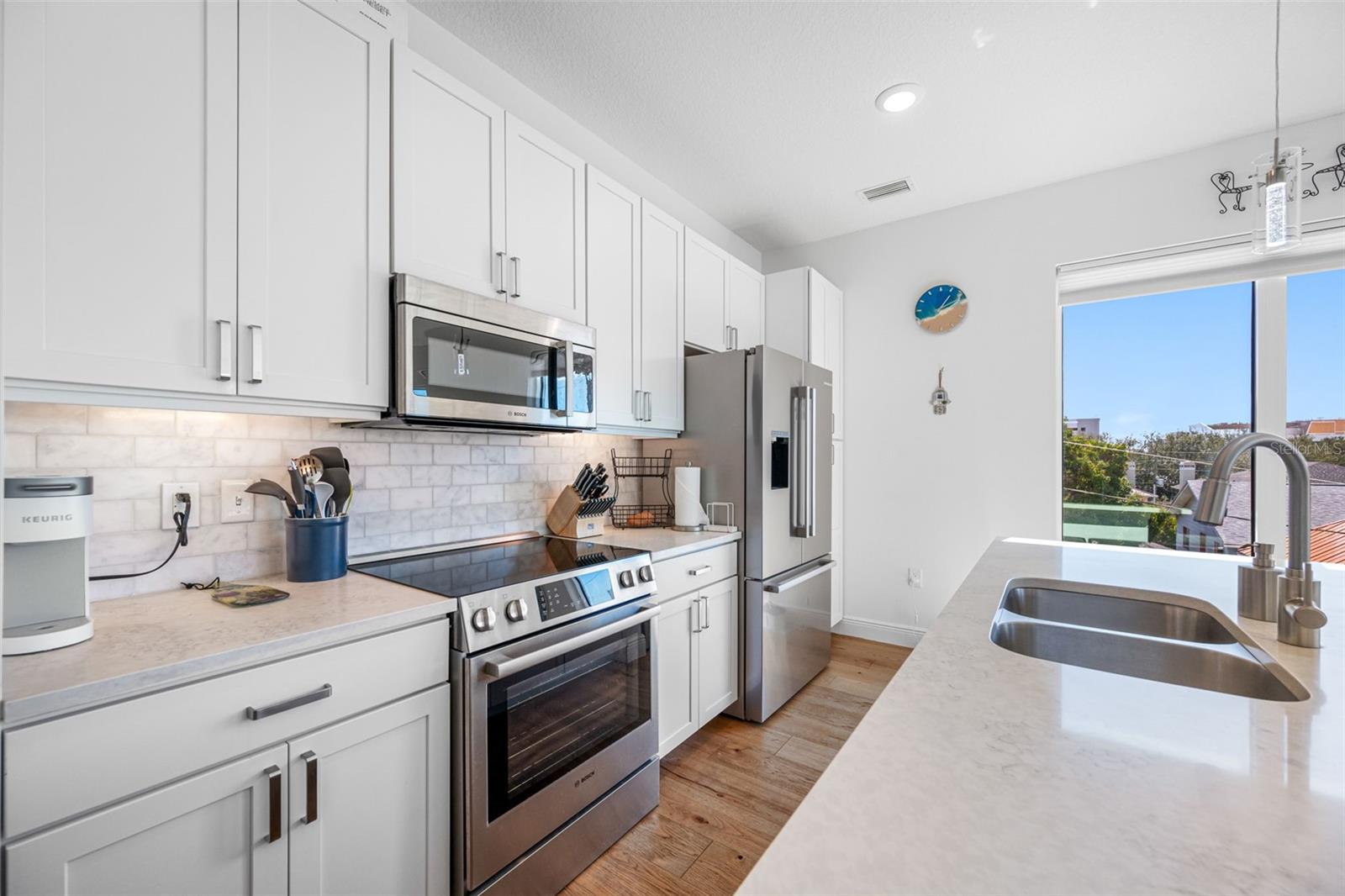 Solid wood white shaker soft-close cabinetry