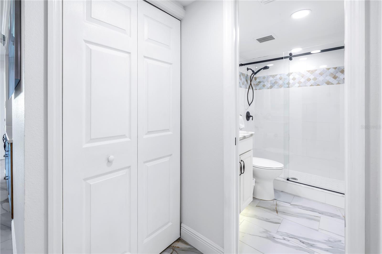 Main bathroom located off kitchen.Washer and dryer is behind the closet doors