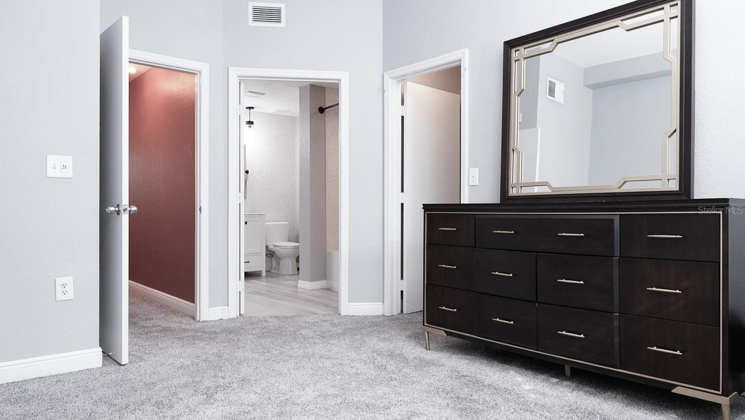 Primary Bedroom with two Walk In Closets and En-suite Bathroom