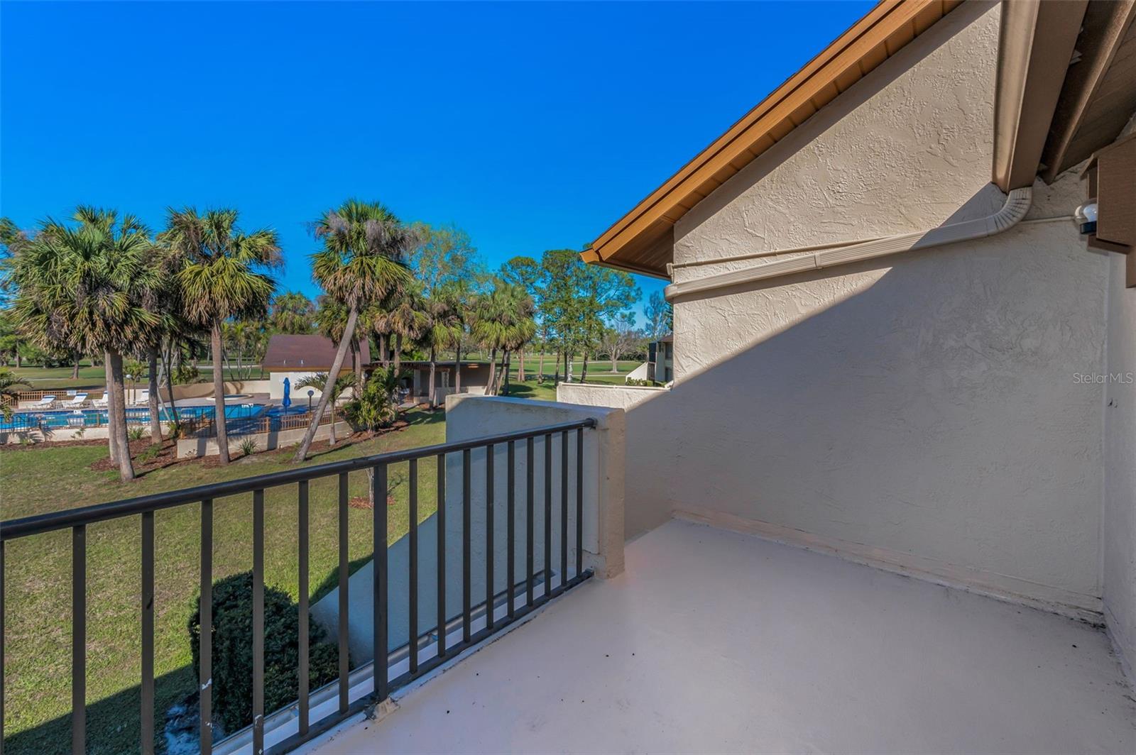 Your balcony view at Fairway Villas, The view of the pool and the Fairways of Bardmoor North Course!