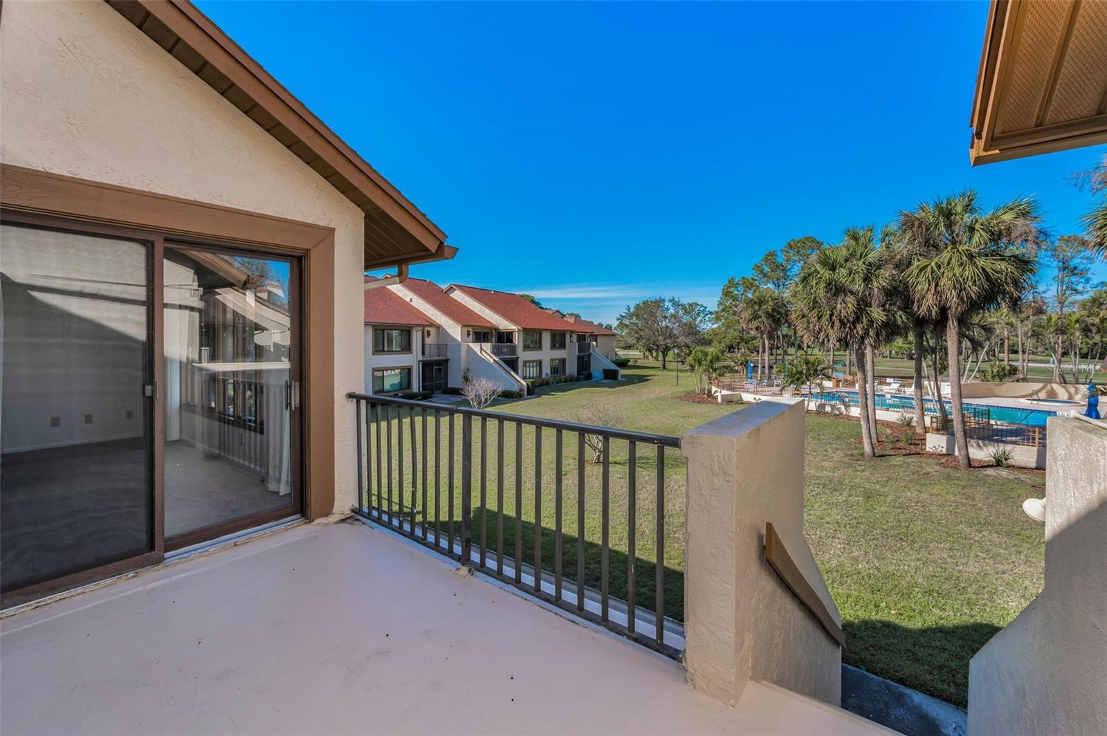 The view from your balcony: the pool and the gorgeous fairways!