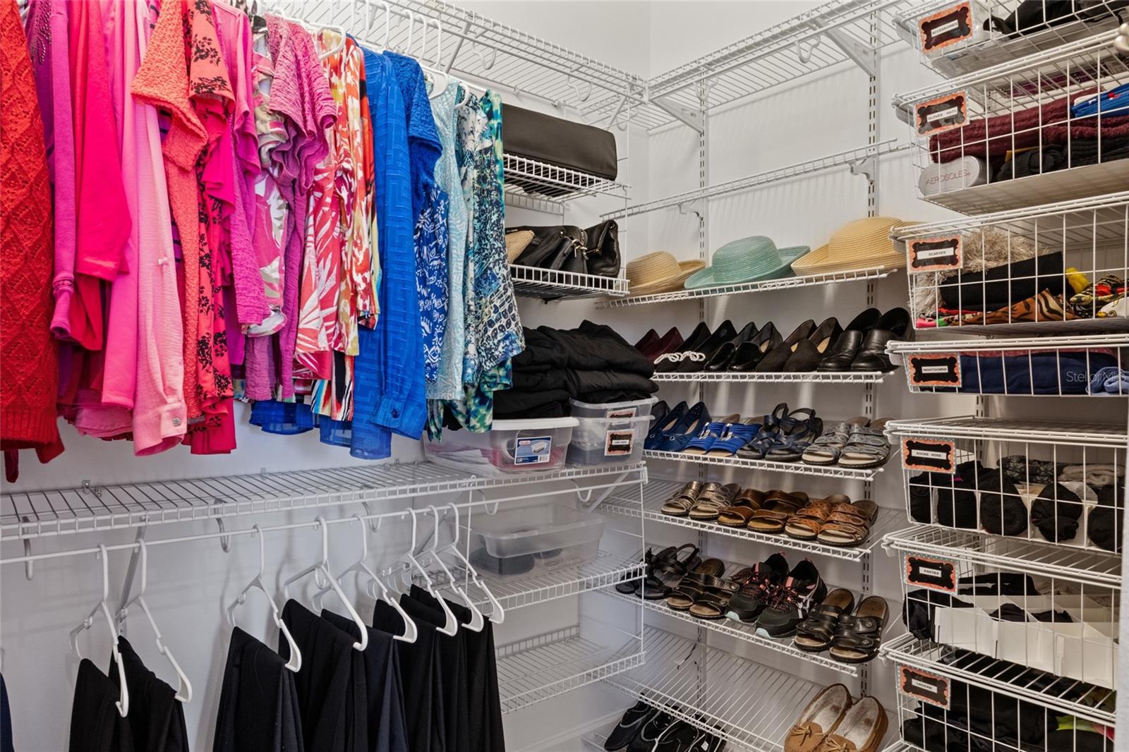 Master closet with very thought-out organizational system