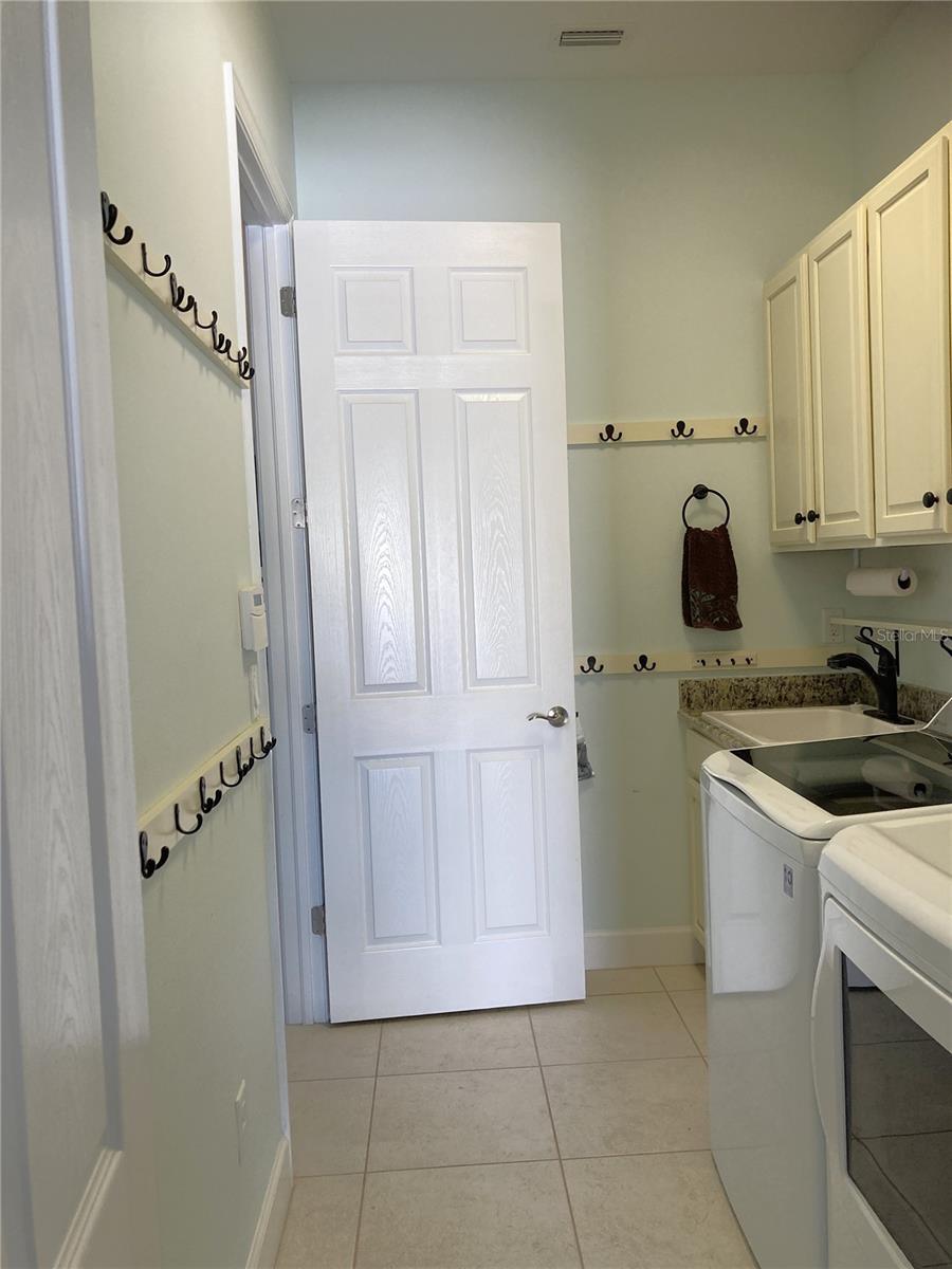 Inside Laundry Room view from Garage going to Hallway