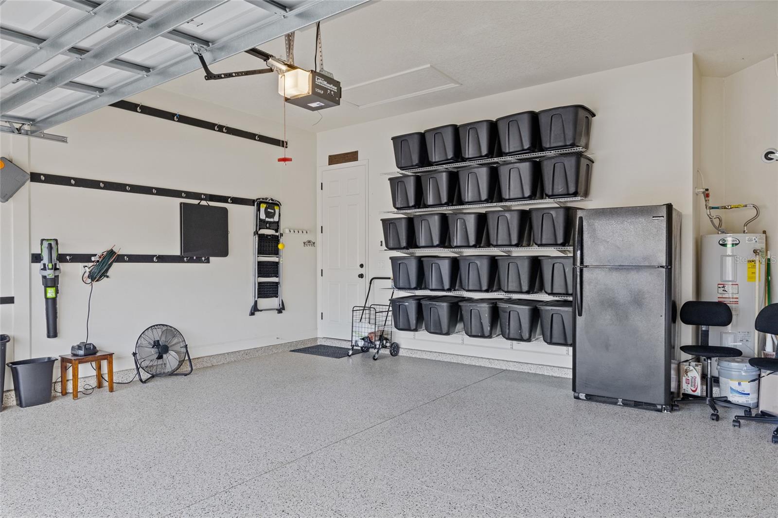 Plenty of storage options in the two-car epoxy floored garage