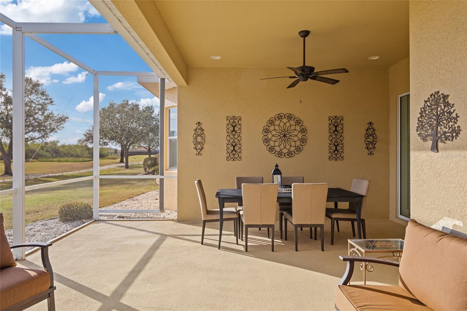 Extended L-Shaped lanai with recessed lighting and ceiling fan to enjoy Florida outdoor living