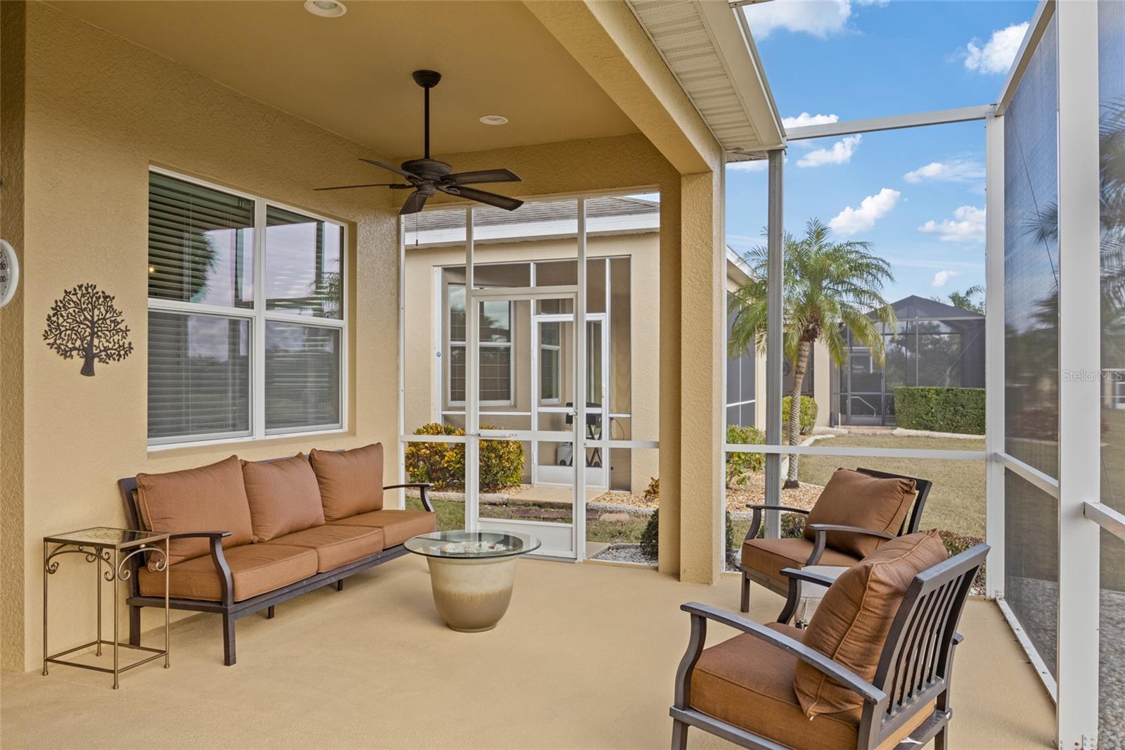 Extended L-Shape screened lanai with recessed lighting and ceiling fans overlooking the 7th hole of the golf course. Great space for entertaining and drinking your morning coffee.