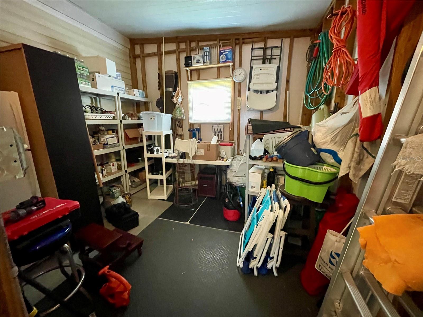 Florida room off the laundry room... workshop/storage shed is to the left.