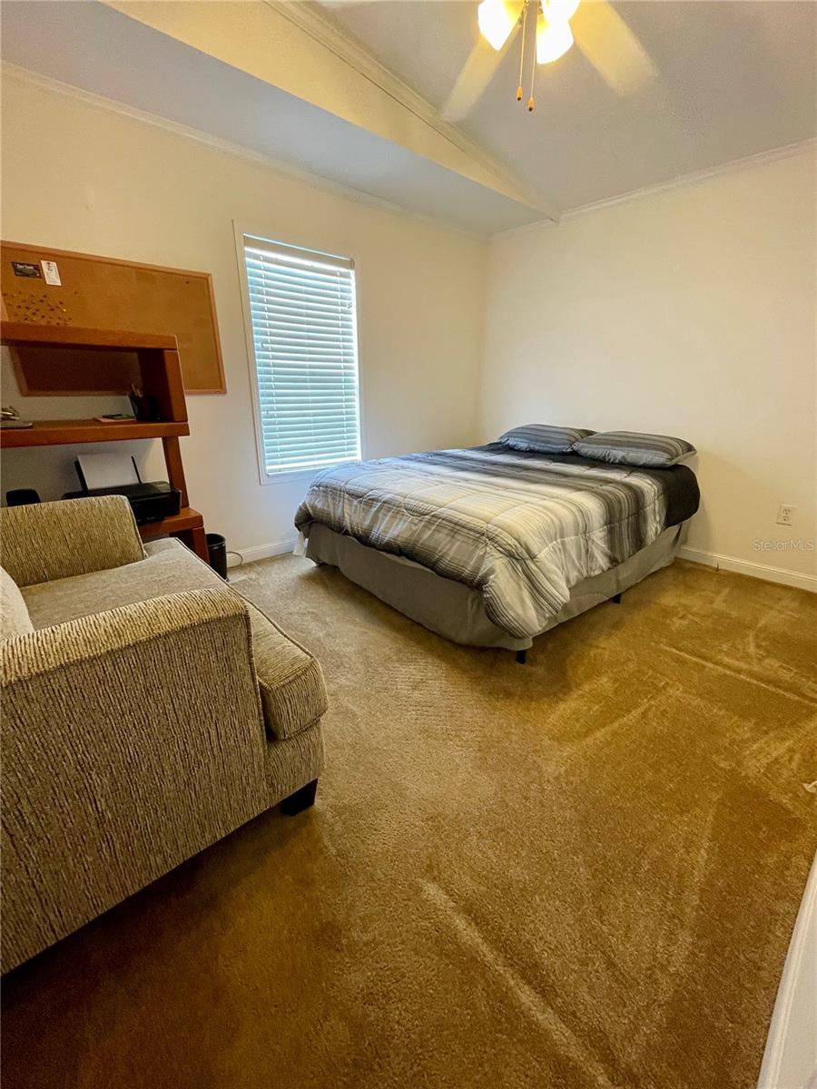 Front bedroom with a walk-in closet