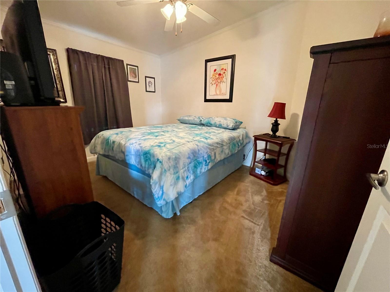 Middle bedroom with a walk-in closet