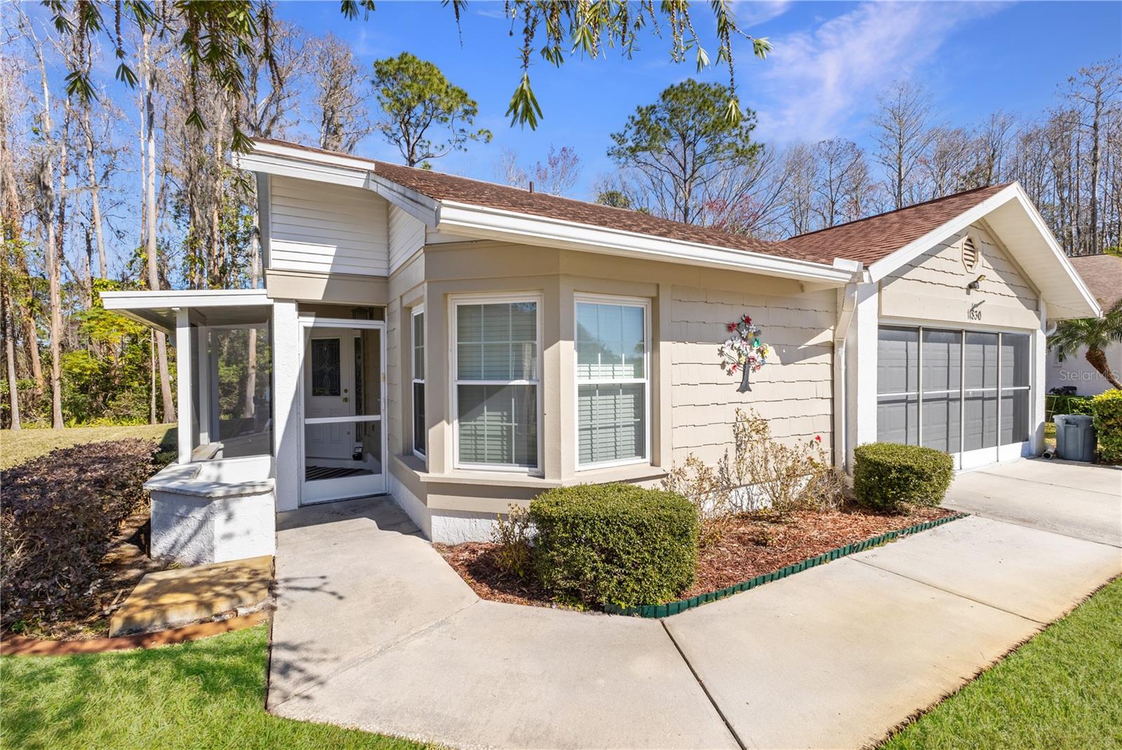 Enjoy your screened front porch & garage