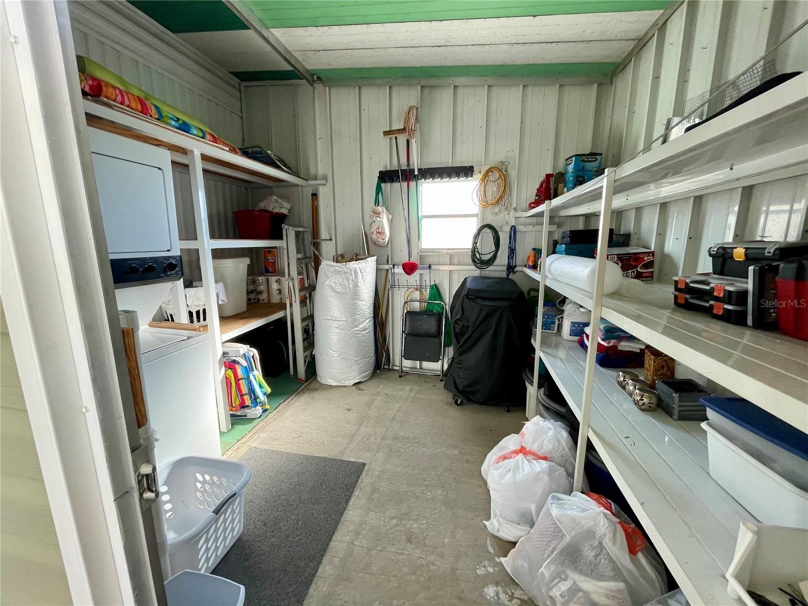 Shed/storage area, with a stackable washer-n-dryer.