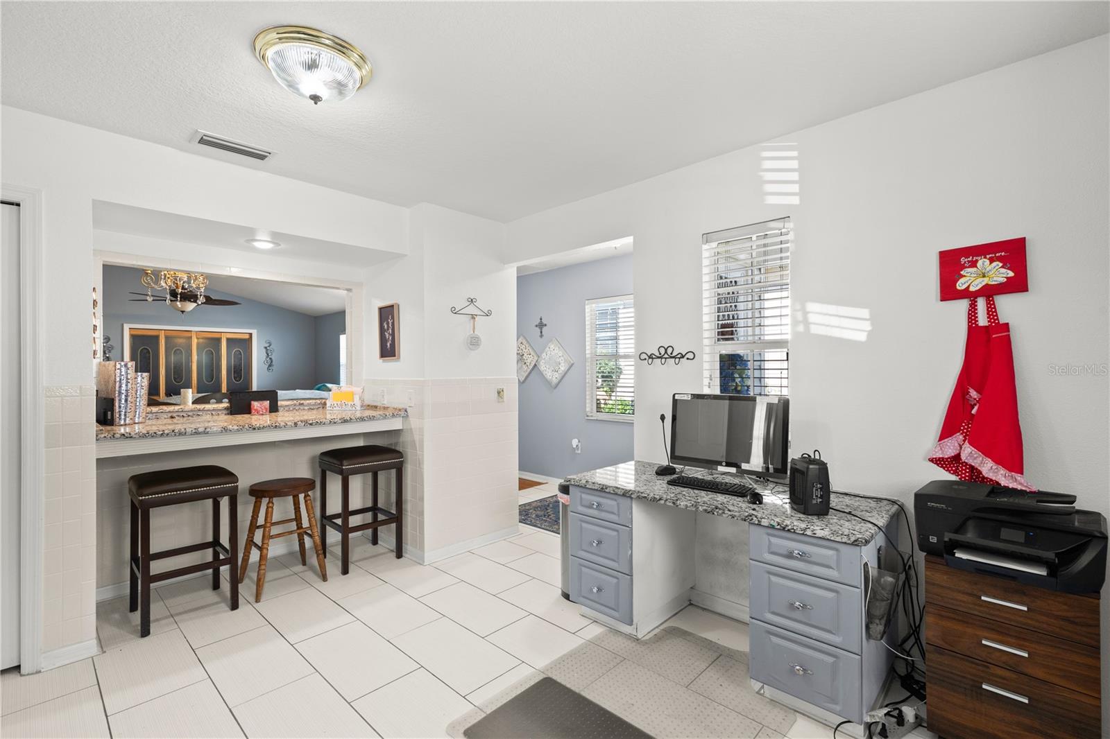 breakfast bar and built in desk in kitchen